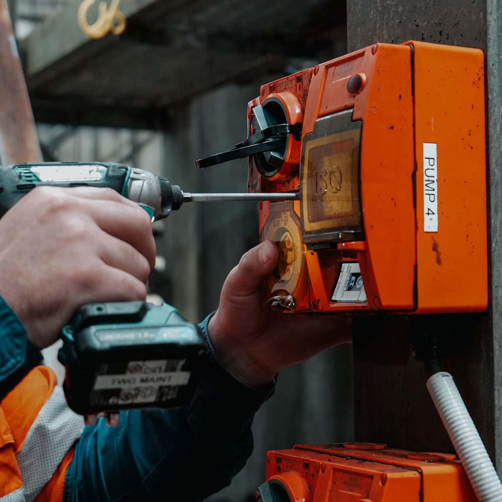 A drill being used to do electrical work